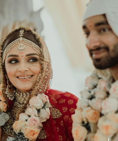 A candid looking shot in which bride looks at groom