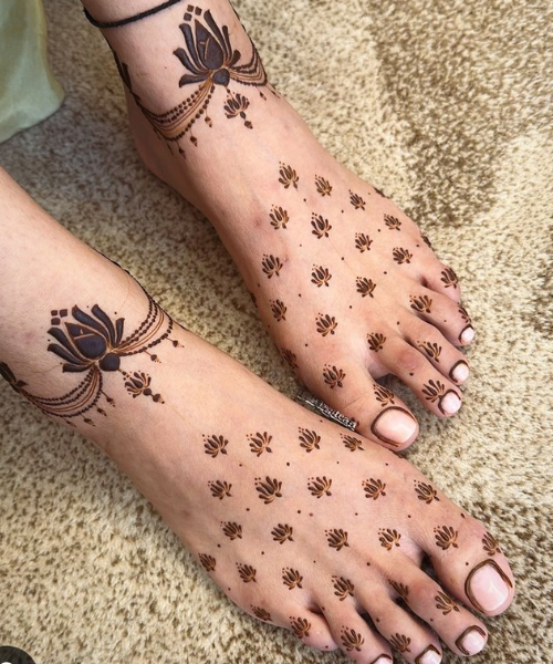 Minimal foot mehndi design with lotus motif