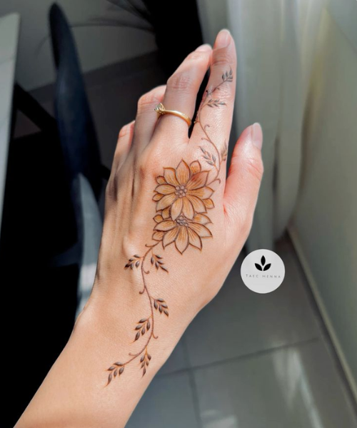 Back hand mehndi with flower, vine and leaves