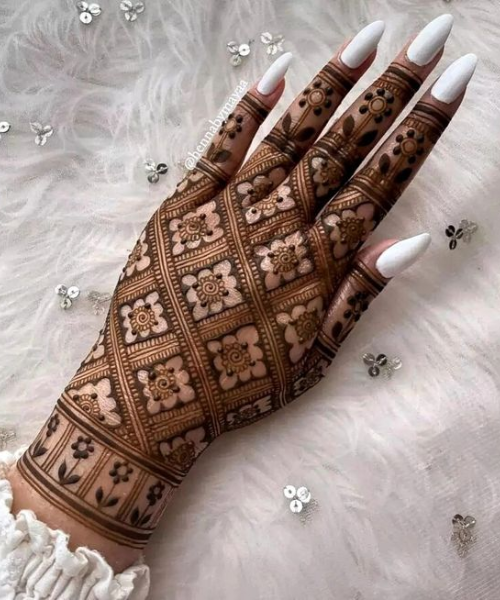 Back hand mehndi with checker patter with flower