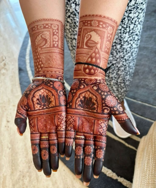 Full Hand Mehndi with lotus and peacock motifs