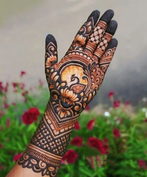 Full hand mehndi design with peacock over lotus