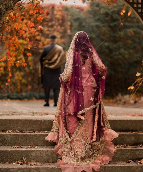 Candid shot of bride running to groom