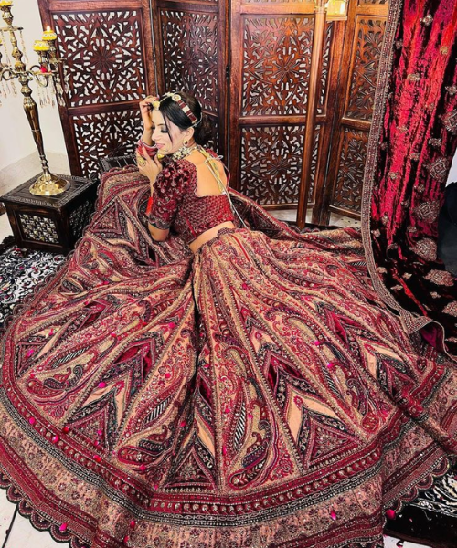 Elaborate paisley motifs on rich maroon fabric