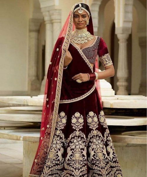 Velvet maroon, gold floral, geometric details lehenga