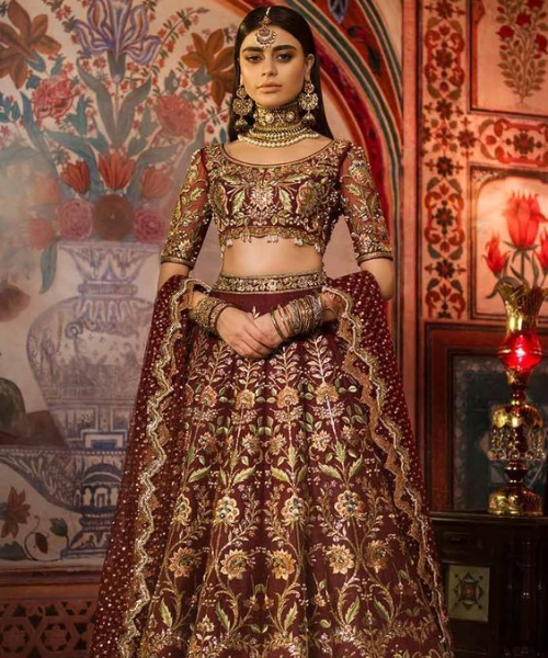 Floral gold embroidery on maroon, opulent and intricate