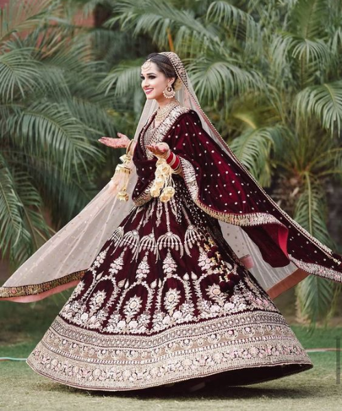 Intricate gold motifs on maroon, rich traditional elegance