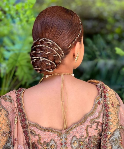 Braided bun intertwined with delicate gold chains