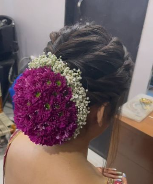 Bold Floral Bun with Purple Blooms