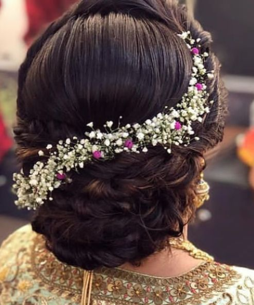 Braided Bun with Baby's Breath Flower and Pink Accents