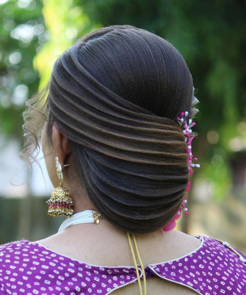 Sleek Twisted Bun with Pink Accents