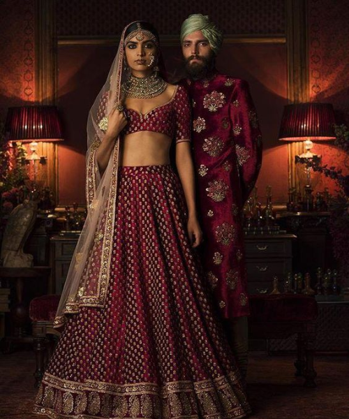 Maroon lehenga with gold polka dots and minimal design