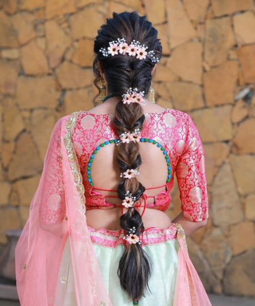 Bubble Braid with Floral Embellishments for a Playful Bridal Look