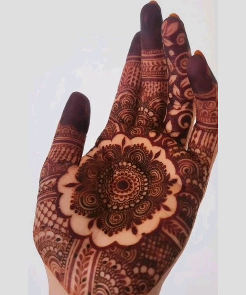 Intricate Floral Arabic Mehndi with Dark Accents