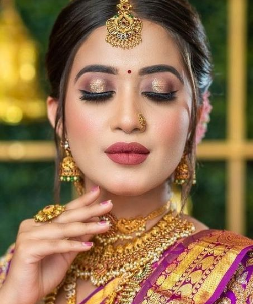 Golden Glam Bridal Look with Bold Lips and Dramatic Eyes