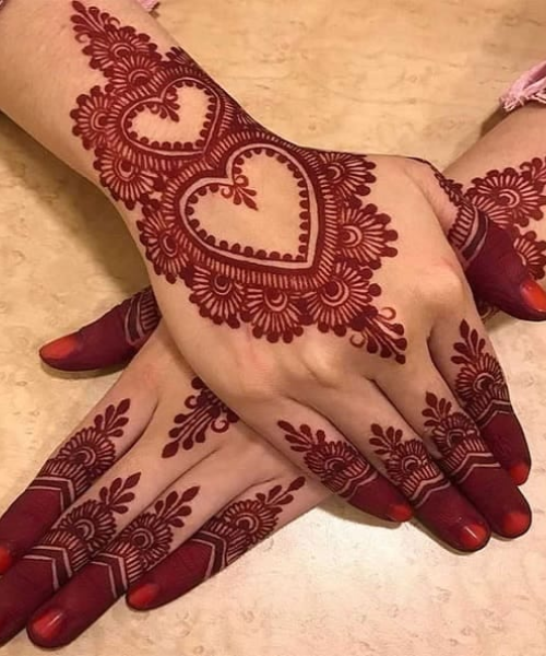 Romantic Arabic Mehndi with Bold Heart Motifs and Floral Accents