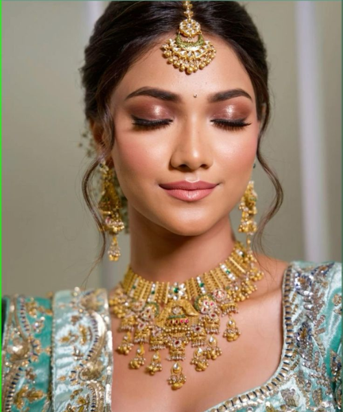 Shimmering Bridal Look with Metallic Eyes and Soft Pink Lips