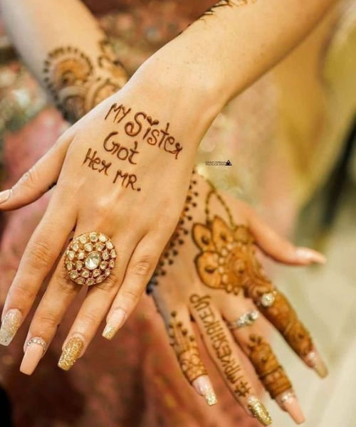 Playful mehndi design with the text “My Sister Got Her Mr.” on hand