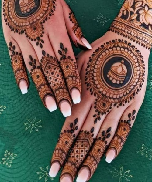 Back hand mehndi with mandala with jhumka inside it