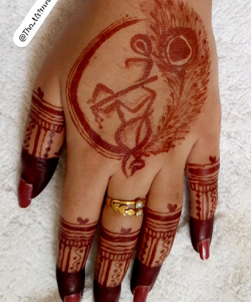 Simple back hand Krishna mehndi design