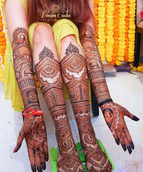 Posing to show both hands and leg mehndi