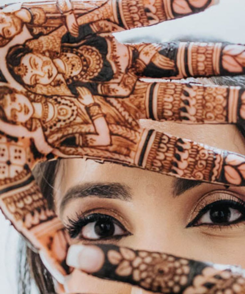 Close-up shot of eyes and mehndi