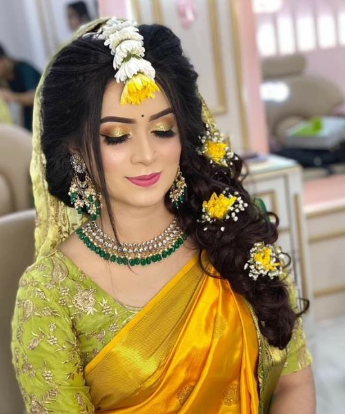 Vibrant Mehndi Look with Floral Elegance