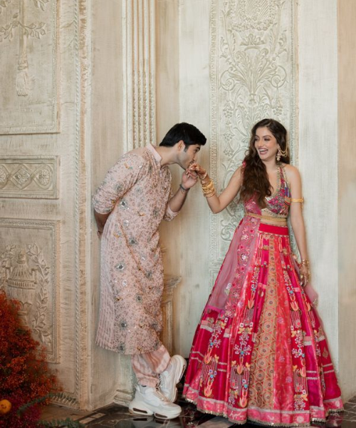 Playful Hand Kiss Pose with Laughing Bride