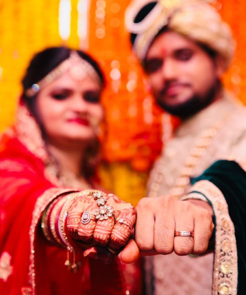 Ring Focused Fist Bump Pose with Blurred Faces