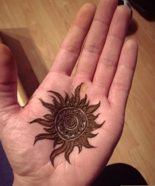 Sun-Themed Circular Mehndi with Flame Motifs