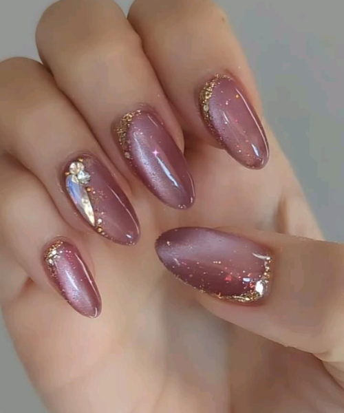Glossy Mauve Nails with Gold Sparkle