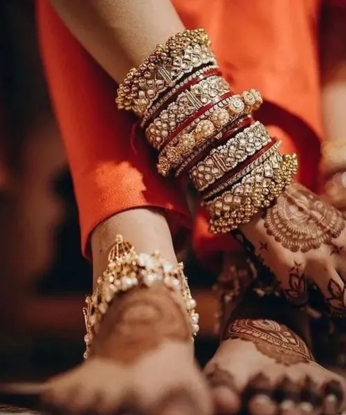 Gold-studded bridal chura in red hue
