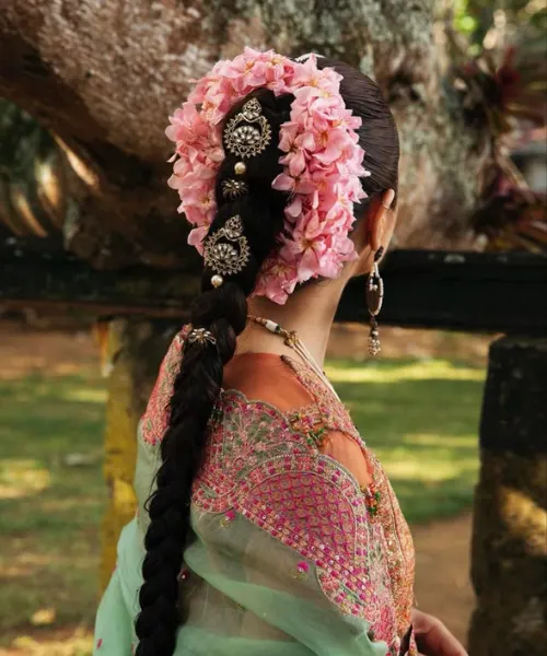 Braided Bun with Pink Floral Elegance