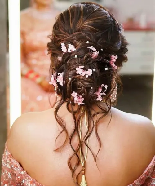 Messy Bun with Pink Floral Accents