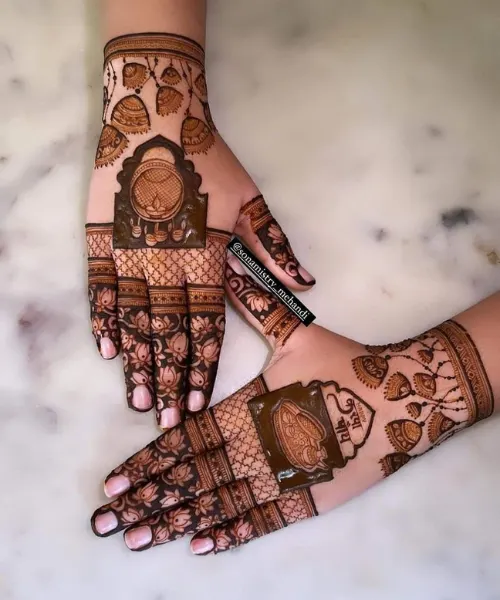 Traditional Hand Mehndi with Bells and Kalash Motifs